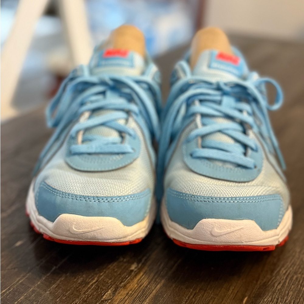 These light blue Nike Revolution running shoes. Size 6.5Y